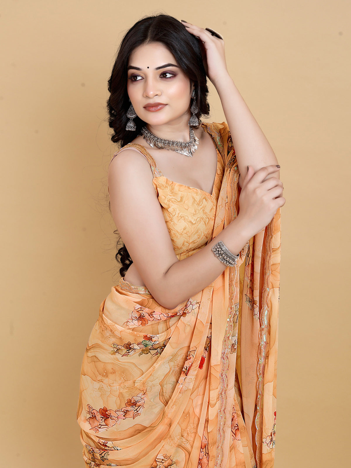 Weightless Orange Saree with Multicolored Designs