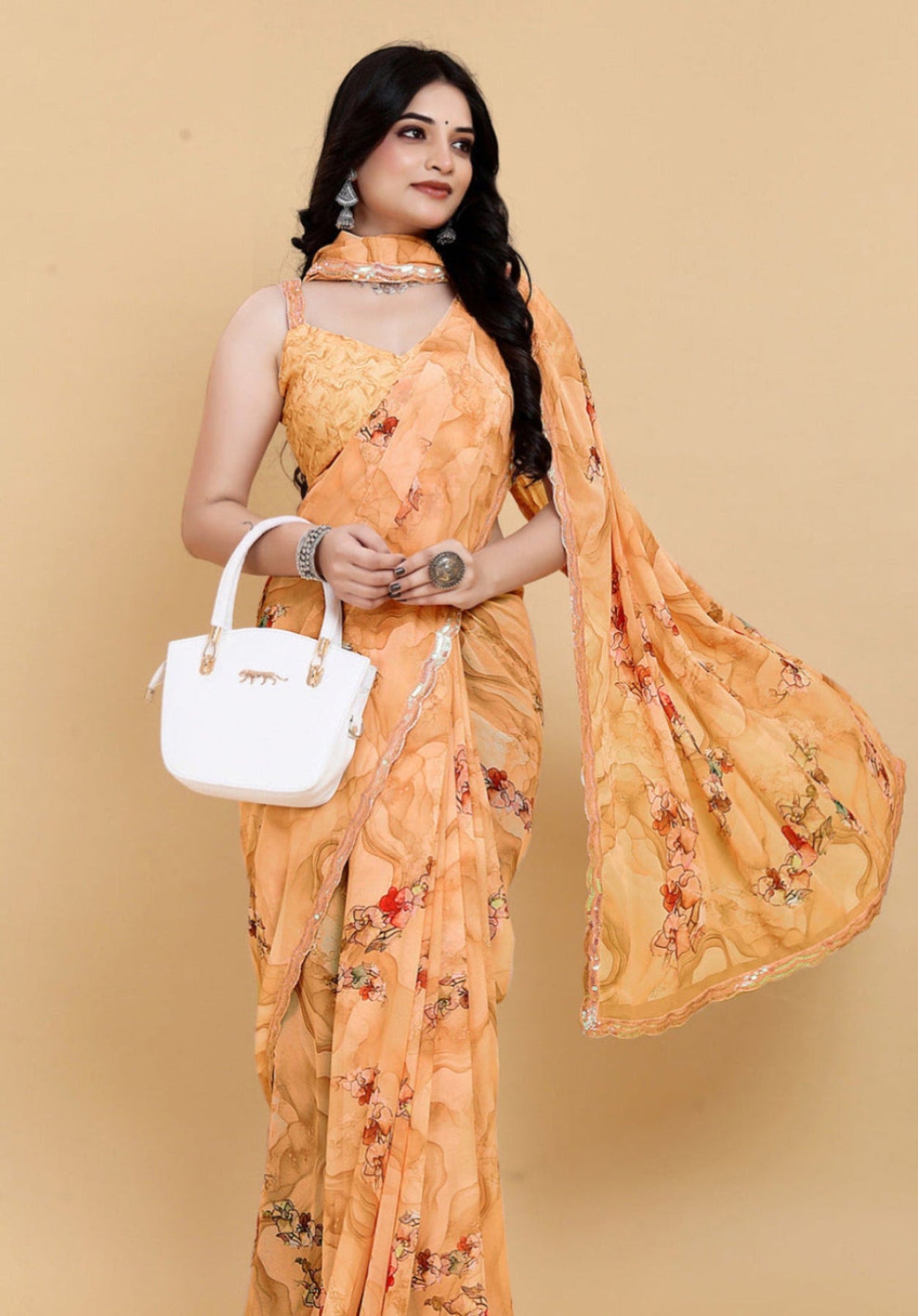 Weightless Orange Saree with Multicolored Designs