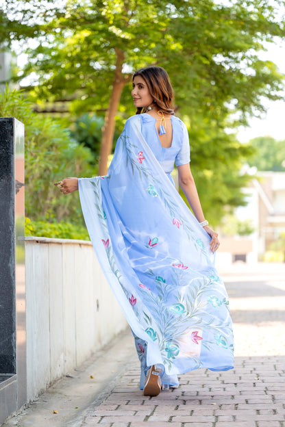 Chiffon Sky Blue Saree Featuring Delicate Hand Painted Floral Motifs