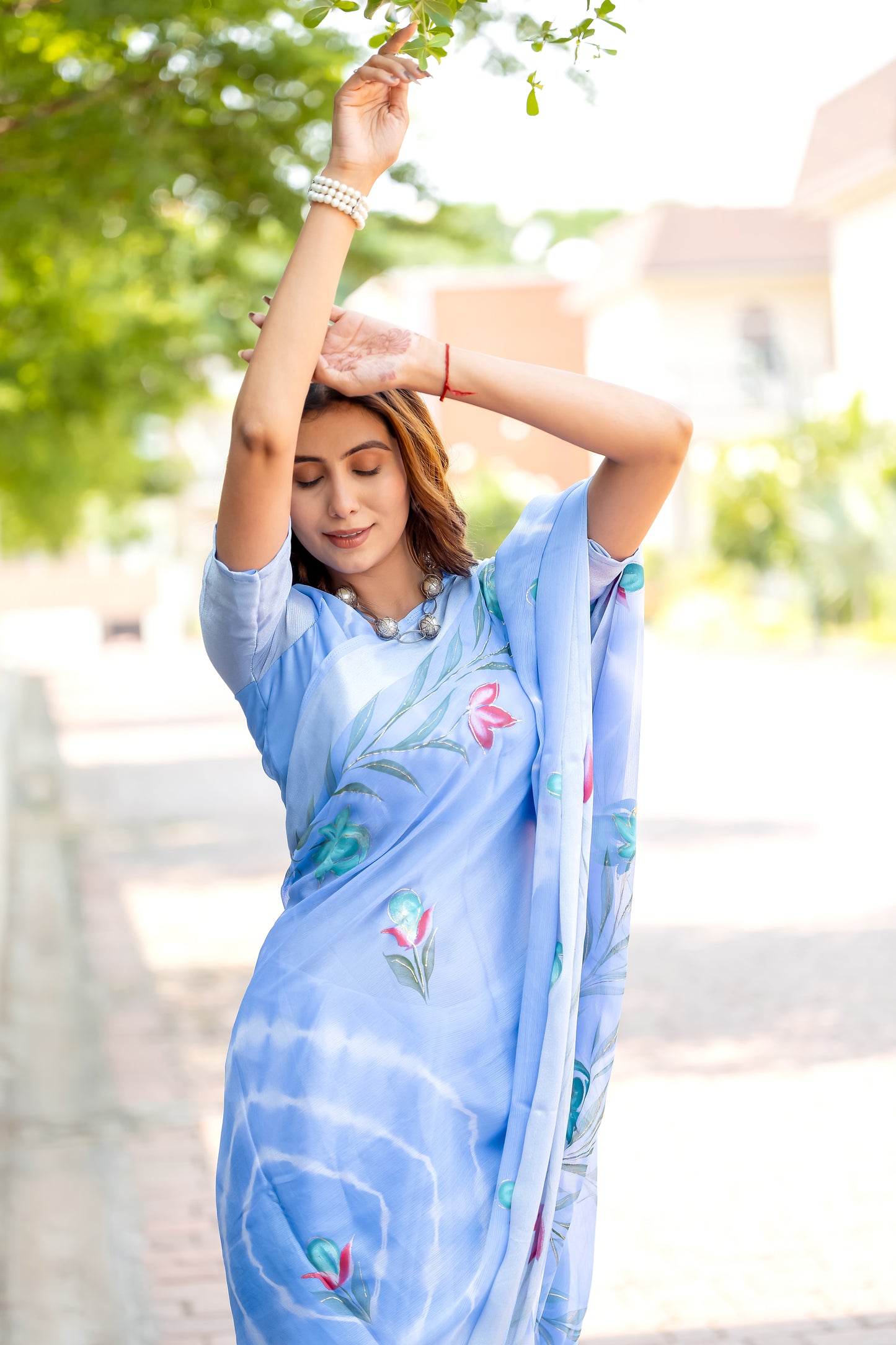 Chiffon Sky Blue Saree Featuring Delicate Hand Painted Floral Motifs