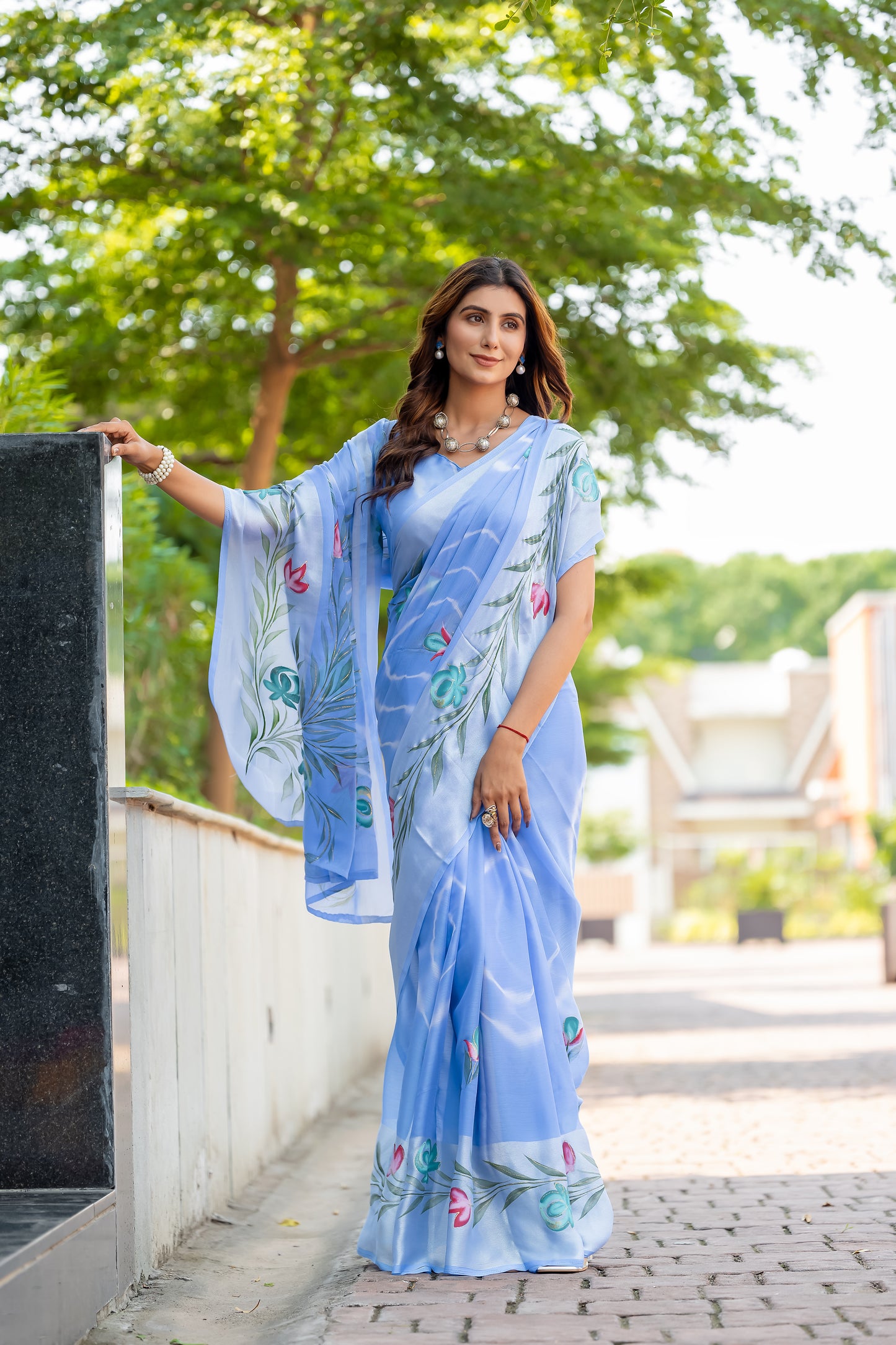 Chiffon Sky Blue Saree Featuring Delicate Hand Painted Floral Motifs