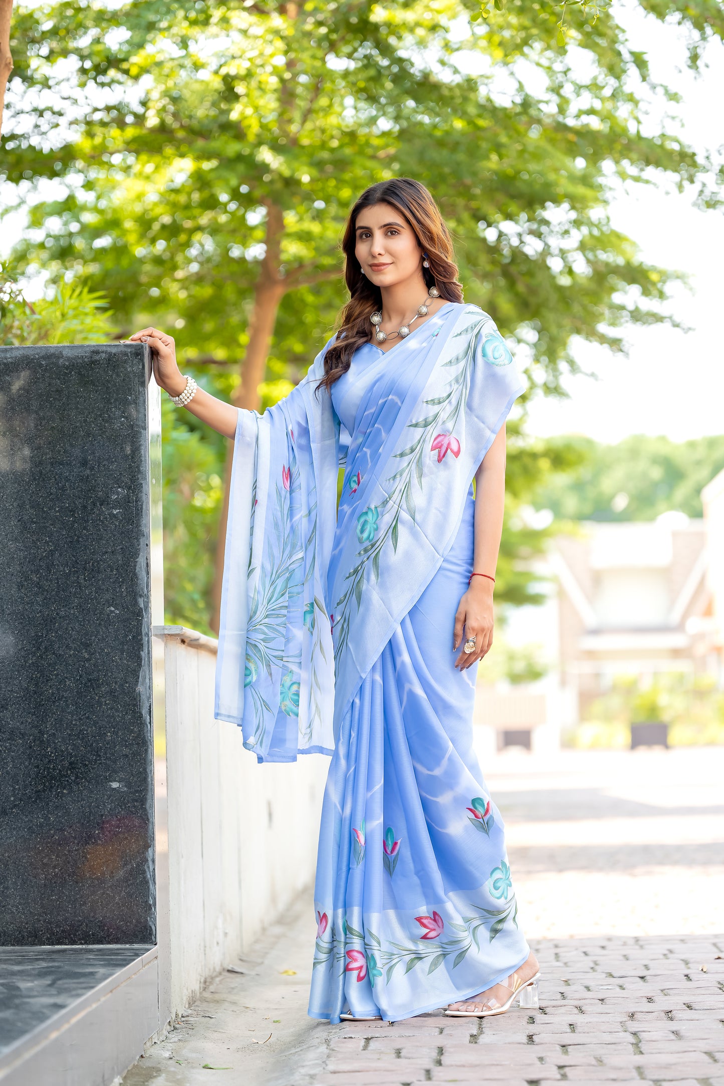 Chiffon Sky Blue Saree Featuring Delicate Hand Painted Floral Motifs
