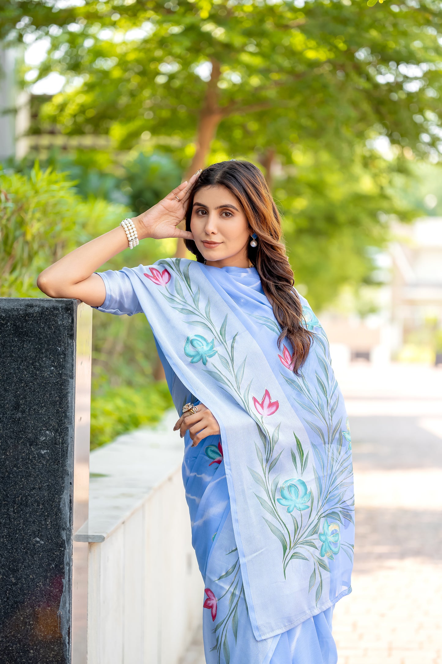 Chiffon Sky Blue Saree Featuring Delicate Hand Painted Floral Motifs