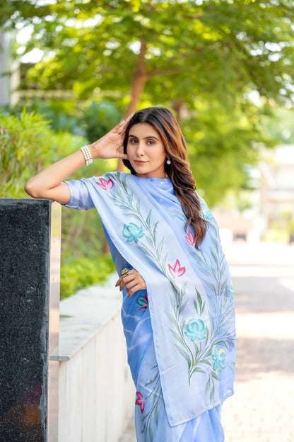 Chiffon Sky Blue Saree Featuring Delicate Hand Painted Floral Motifs